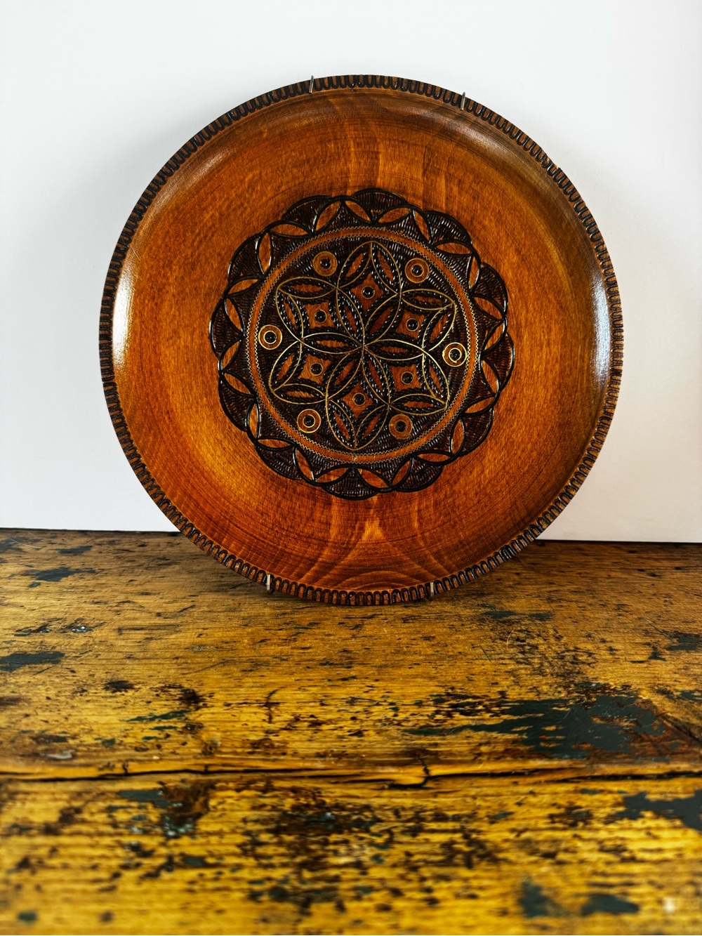 Hand-Carved Wooden Decorative Plate in Warm Brown
